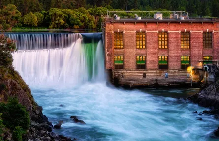 Waterfall near brick building