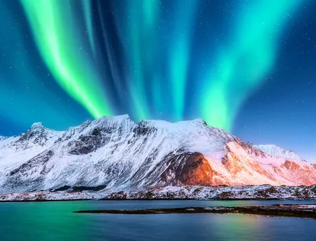 Northern lights over mountain range