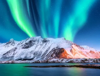Northern lights over mountain range