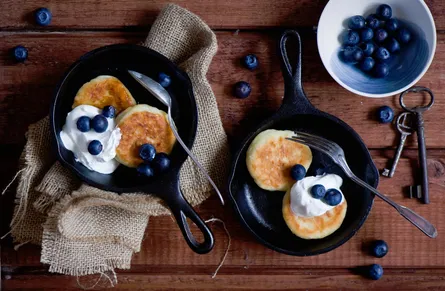 Blueberry pancakes with whipped cream