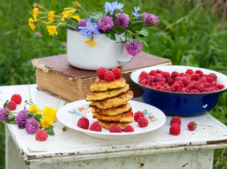 Table raspberries cake plate flowers blue jar