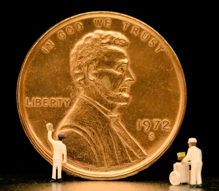 Figure of Abraham Lincoln coin, two men figurines, scale model