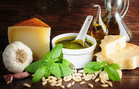 Cheese, olive oil, herbs, nuts on platter