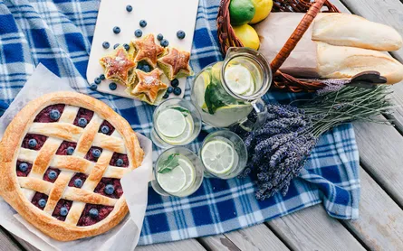 Pie, drinks and bread on table