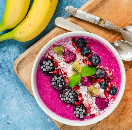 Smoothie bowl with fruit and nuts on top