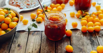 Jars of Honey and Lemons by Yellow Flowers