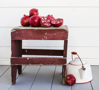 Colorful Pomegranates on Wooden Table