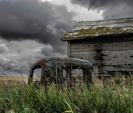 Abandoned truck in field
