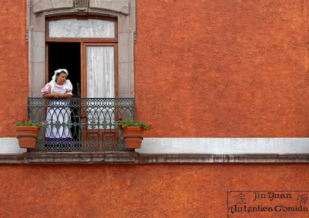 Woman looking out window