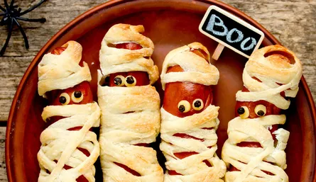 Creepy hot dogs wrapped in dough