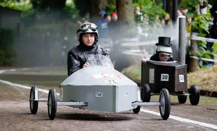 Man driving a small car