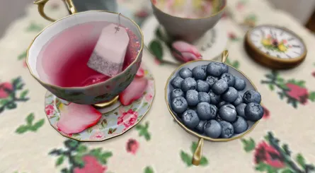 Tea and blueberries on table