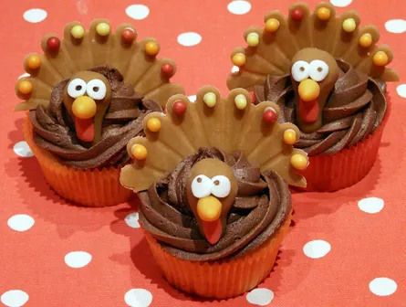 Three cupcakes with turkey designs