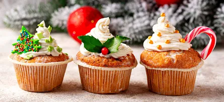 Three cupcakes with sprinkles and candies