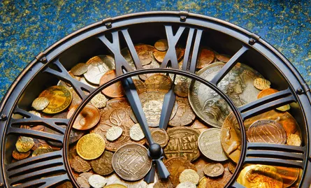 Clock with coins on it