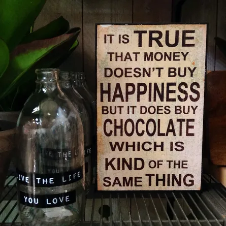It is true that money doesn't buy happiness but it does chocolate, which is kind of the same thing