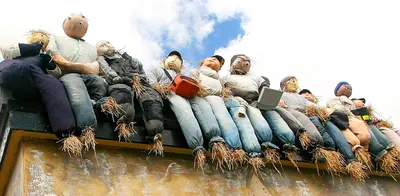 Scarecrows on building