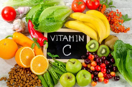 Fruit and vegetables on wooden board