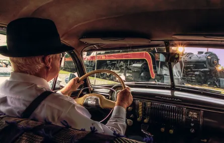 Man driving vintage car