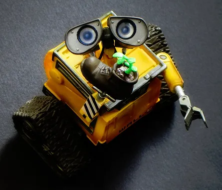 Small yellow toy car with plant