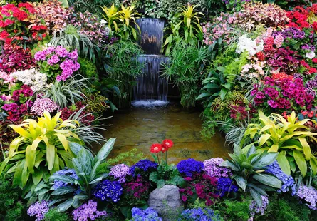 Colorful garden with waterfall and pond