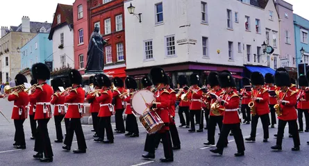 Marching band, uniforms, city street